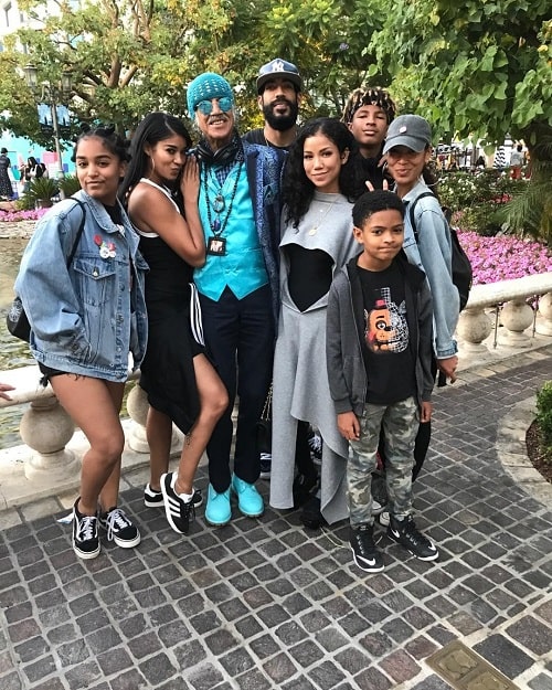 A picture of Christina's kids and grand-children with Dr. Karamo Chilombo.